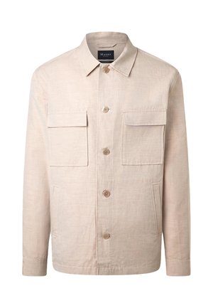 Beige nappikaulus, jossa pitkät hihat, kaksi rintataskua läpällä ja kaksi sivuviisteistä taskua, valmistettu teksturoidusta kankaasta.