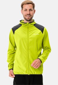 Helle grüne, leichte Jacke mit schwarzen Akzenten, Reißverschluss und Kapuze. Sie verfügt über einen glatten, strukturierten Stoff und Seitentaschen.
