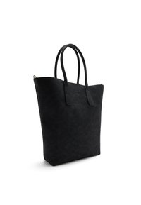 Zwarte totebag van zacht leer, met twee handvatten, een minimalistisch ontwerp en een lichtgestoorde oppervlakte met zichtbare stiksels.