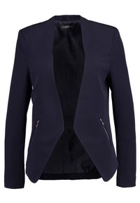 Blazer azul marino hecho de material suave, con cuello chal, apertura frontal y dos bolsillos con cremallera en los laterales frontales.