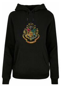 Svart hettegenser med et fargerikt Hogwarts-våpenskjold på forsiden, samt kengurulomme og ribbestrikkede mansjetter og nederkant.