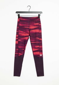 Paars en rode leggings met patroon, met een hoge taille, gemaakt van rekbaar materiaal, met zijpanelen en een Adidas-logo dicht bij de zoom.