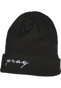 Crna pletena kapa s preklopom. Na prednjoj strani sadrži riječ "pray" izvezenu bijelom kurvilinijom. Mekana tekstura, rastezljiv materijal.