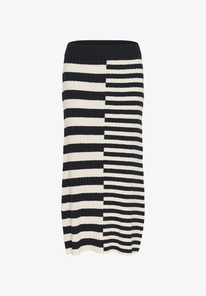 Adīta svītraina zīda svārku ar ribotu tekstūru, kurai ir maiņojošas melnā un krēmkrāsas horizontālās svītras un pieguļošs jostasvērts.