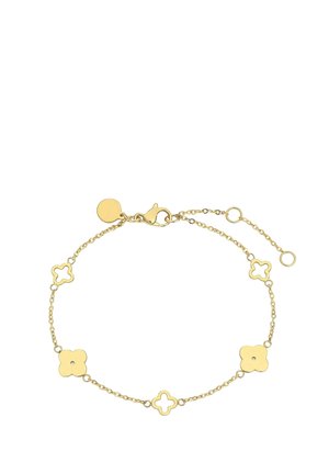 Delicate gold chain bracelet with alternating solid and open clover-shaped links and a lobster clasp closure with adjustable length.