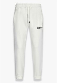 Hvide joggingbukser lavet af blødt stof, med elastisk talje, justerbar snor og sort "Dropsie" logo på siden.