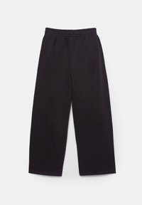 Pantaloni negri din bumbac, cu croială largă, talie elastică și fără cusături vizibile, având o textură netedă și o croială lejeră.