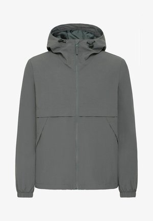 Lengvas pilkas džemperis su užtrauktuku priekyje, kapišonu, elastinėmis rankovėmis ir dviem šoninėmis kišenėmis. Pasižymi kontrastingo užtrauktuko detale. Lygus audinio paviršius.