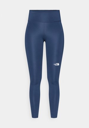 Leggings blu navy realizzati in un tessuto liscio ed elastico, con una vita alta e un dettaglio logo bianco sulla parte inferiore della gamba.