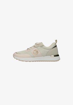 Athletic sneakers in beige and cream mesh, featuring a round logo, gold accents, flat laces, and a textured outsole for grip.