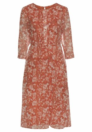 Rust-colored floral dress with long sheer sleeves, round neckline, buttoned front, and a cinched waist.