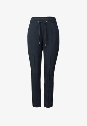 Pantalones jogger en color azul marino, confeccionados con una tela suave, que cuentan con una cinturilla elástica con cordón, costuras laterales y perneras ajustadas con puños en los tobillos.