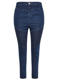 Jeans de mezclilla azul oscuro con cintura alta, que cuentan con paneles acanalados texturizados en los muslos y un ajuste esbelto en los tobillos.