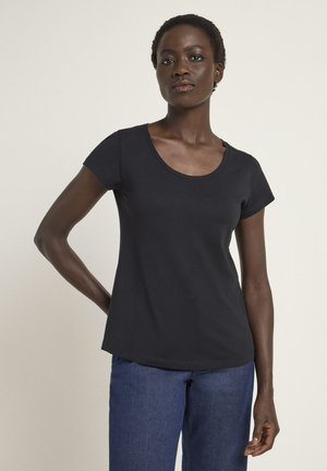 Black short-sleeve T-shirt with a scoop neckline, made from soft fabric, featuring a relaxed fit and smooth texture. Worn with blue jeans.