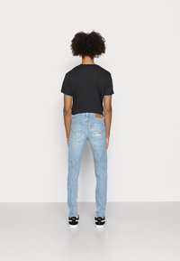Levi's® SKINNY TAPER - Calças de ganga de corte skinny - lefkas moonlit