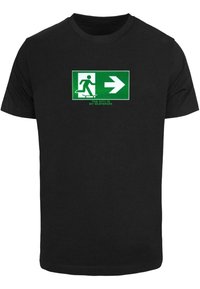 Černé bavlněné tričko s grafickým potiskem skateboardisty a textem "MĚSTO JE MŮJ SKATEPARK," zvýrazněným šipkou.