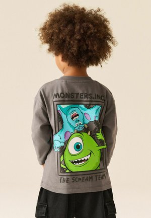 Next, MONSTERS INC, szary