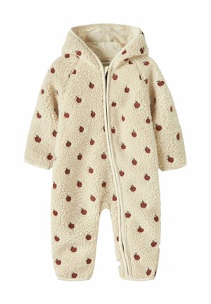 Hættebamse i cremefarve med brune æblemønstre og frontlynlås, lavet af blødt struktureret fleece materiale.