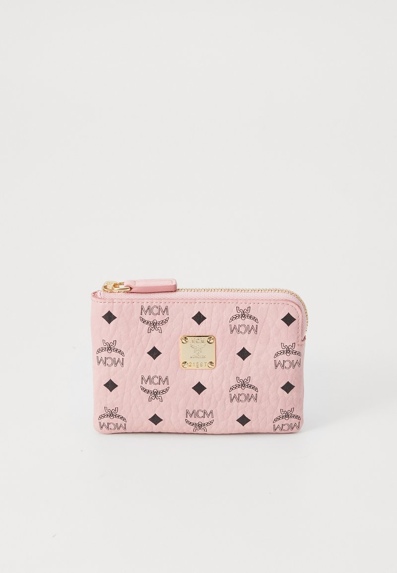 Pink leather wallet with a textured finish, featuring MCM logos and black diamond accents, gold hardware, and a zip closure.