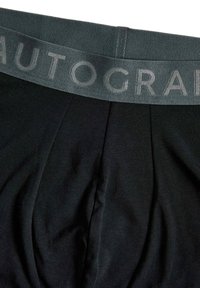 Boxers de algodón negros con una cinturilla elástica gris que presenta el texto en relieve "AUTOGRAPH". Textura suave con detalles de diseño plisados.