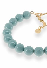 Bracelet with large glossy pale blue beads and gold chain clasp featuring a small round gold tag.