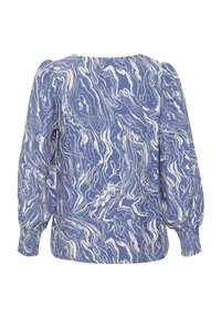 Blouse bleue à manches longues avec motif abstrait blanc en spirale, épaules bouffantes et poignets froncés.