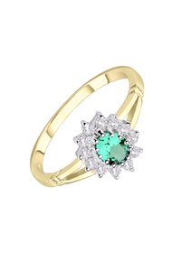 Kuldne sõrmus laiema bandiga, mille keskel on ümar rohelise kivi, mida ümbritseb selgete, ümarate lõigetega kivide halo. Sile tekstuur.