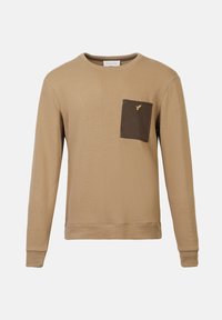 Long-sleeve sweater in tan, featuring a contrasting dark brown patch pocket and a small yellow logo. Made of soft, textured fabric.