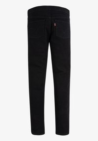 Blugi din denim negru, cu croială slim, având două buzunare din spate, detalii subtile de cusături și o talie pe jumătate înaltă.