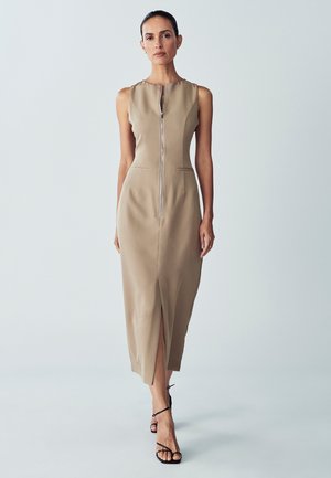 Beige sleeveless midi dress with a front zipper, side pockets, and a front slit. Smooth texture with a fitted silhouette.