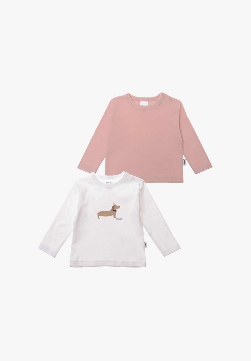 Two long-sleeve shirts: one in soft pink and one in white with a cartoon dog print in brown. Both made of lightweight fabric.