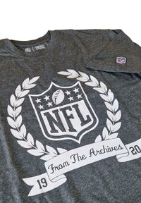 Gray cotton T-shirt featuring a large white NFL logo, laurel leaves, and "From The Archives" text with date banners at the bottom.