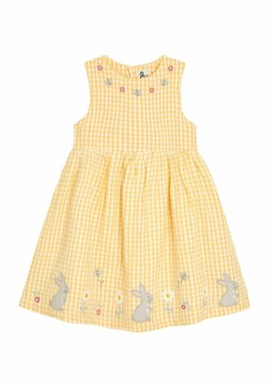 Robe à carreaux jaunes avec un design sans manches. Présente des broderies de lapins et de fleurs, ainsi qu'une jupe froncée. Tissu doux avec une surface texturée.
