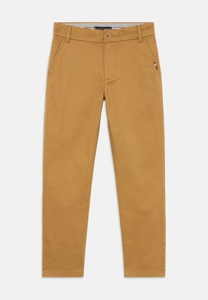 Beige chinos laget av bomull, med knappelukking, sidelommer og slim fit-design. Glatt tekstur med et rent uttrykk.