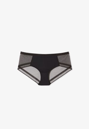 Bragas hipster para mujer negra con panel frontal sólido y laterales y bordes de malla transparente con puntos sobre fondo blanco.