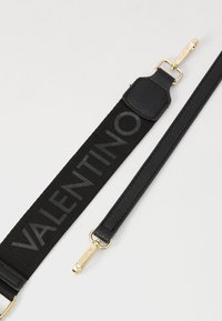 Black strap with textured leather accents, featuring "VALENTINO" in gray lettering, and gold-tone hardware for attachment.