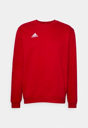 Rode sweatshirt met lange mouwen, ronde hals, gemaakt van katoen. Bevat het witte Adidas-logo op de linkerkant van de borst, ribgebreide manchetten en onderrand.
