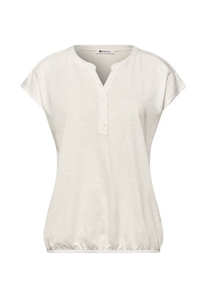 Witte blouse met korte mouwen, ronde kraag, drieknopenpat, losse pasvorm en elastische zoom.