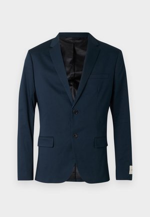 Laivastonsininen bleiseri, valmistettu sileästä kankaasta, jossa on lovettu kaulus, kaksi nappia, kaksi etutaskua ja musta vuori.