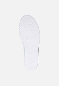 White rubber shoe sole featuring a textured, dotted pattern with an imprint of "souled" at the center and a curved edge design.