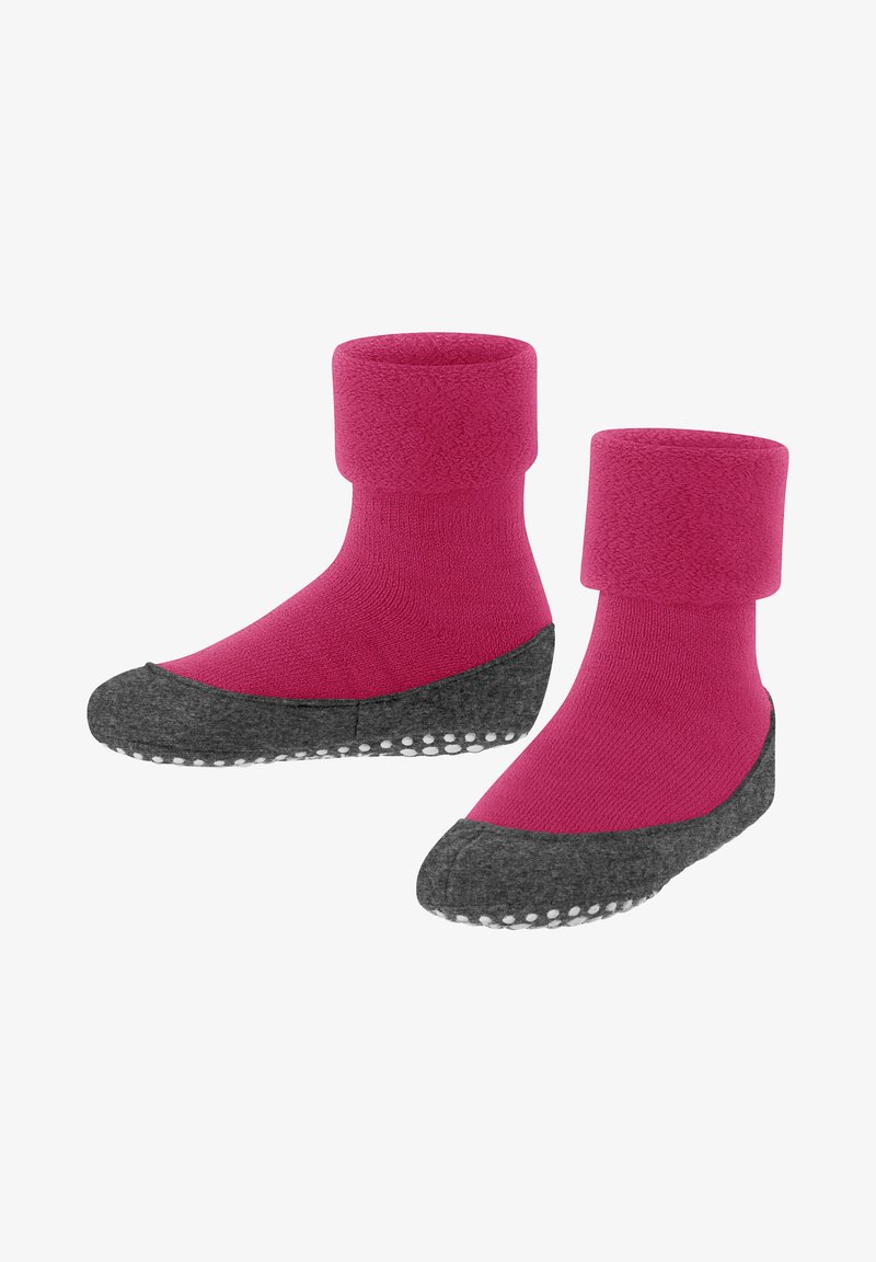 Fuzzy pink socks with a gray, textured sole featuring white grip dots. High ankle design for warmth and comfort.