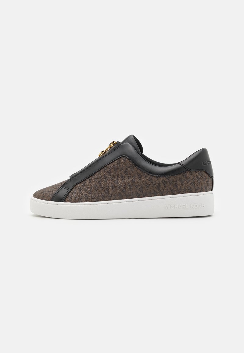 Brown patterned slip-on sneaker with black leather accents and a white sole, featuring a decorative zipper detail.
