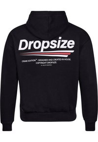 Haut à capuche noir avec un grand logo blanc "Dropsize" au dos, featuring des accents rouges et le texte "Édition Criminelle". Matériau doux, semblable à de la polaire.
