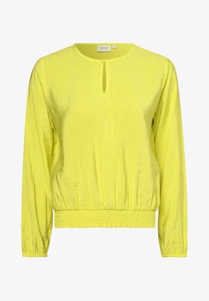 Blouse jaune à manches longues avec encolure ronde, fermeture à bouton en trou de serrure, ourlet et poignets élastiqués, en tissu lisse et brillant.