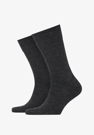 Dunkelgraue Socken aus einem glatten, gestrickten Stoff mit einer Länge bis zur Mitte der Wade und verstärktem Zehenbereich. Einfaches Design ohne Muster.
