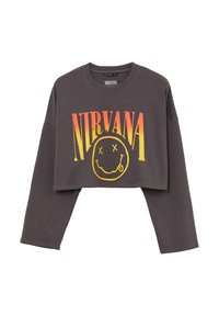 Felpa grigia corta con maniche lunghe, caratterizzata da una grande grafica "NIRVANA" in giallo e arancione e un design di faccina sorridente. Materiale in misto cotone.