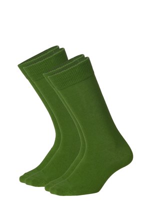 To par ensfarvede grønne ankel-lange strømper vist side om side med ribbede kanter og glat stofstruktur.