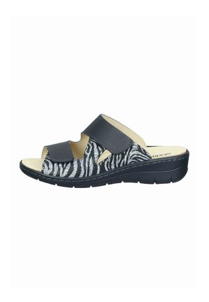 Black and white zebra print open-toe sandal with two adjustable straps and cushioned sole for comfort and support.