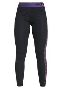 Czarne legginsy z fioletową gumką w talii, na której widnieje napis "NIKE PRO". Po bokach wzór z różowymi kropkami. Wykonane z elastycznego, odprowadzającego wilgoć materiału.