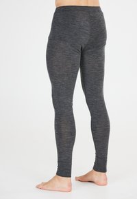 Grå leggings i ett stretchigt material, med en figurnära design och elastisk midja, med en jämn textur och ankellång längd.